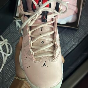They are the Jordan 6 rings in the color light pink with a red jumpman symbol.
